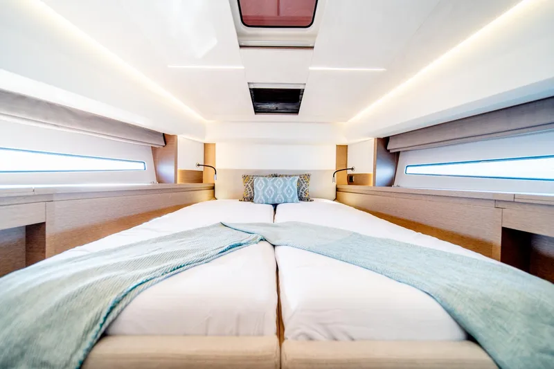 Slide: The Image of Luxurious bedroom interior of 2024 Prestige 460 yacht with modern design and ambient lighting. - 17