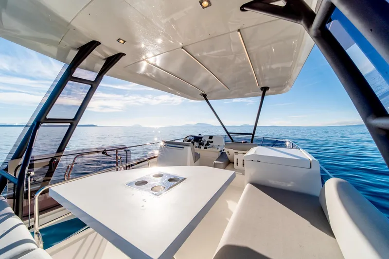 Slide: The Image of 2024 Prestige 460 yacht interior with ocean view. - 23