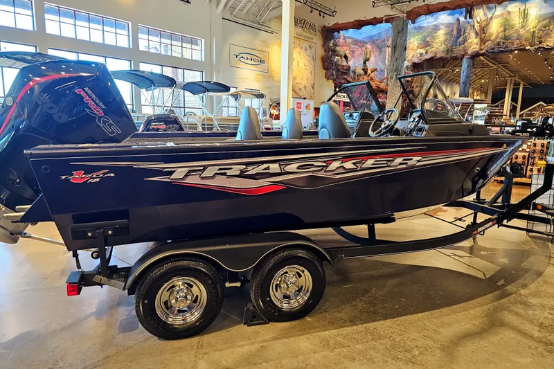 Slide: The Image of 2023 Tracker Targa V-18 WT boat on display in showroom. - 4