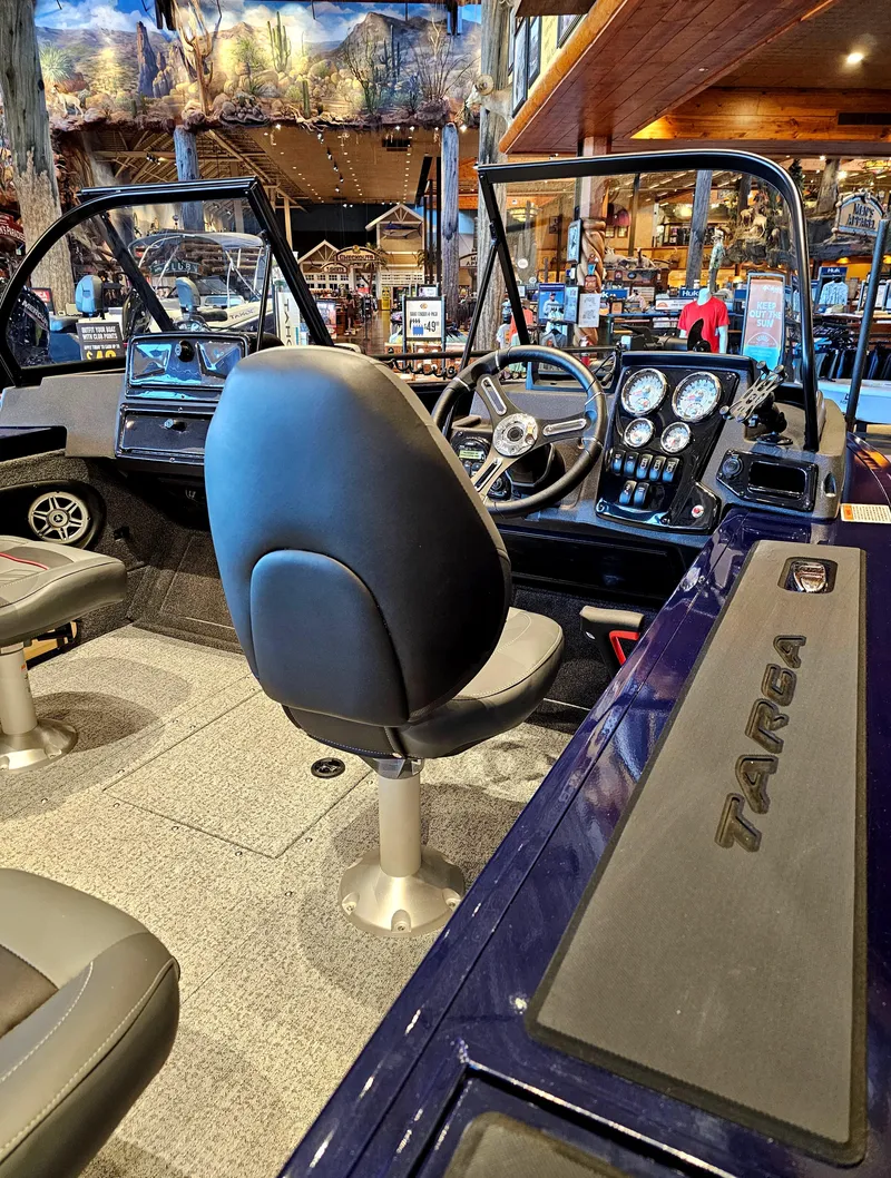 Slide: The Image of 2023 Tracker Targa V-18 WT boat interior with dashboard and seating. - 6