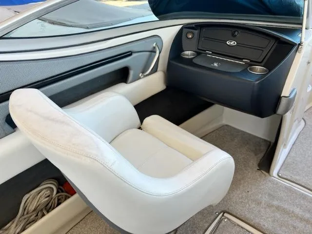 Slide: The Image of Interior of 2008 Sea Ray 230 Select Fission boat with white seating and dashboard. - 10
