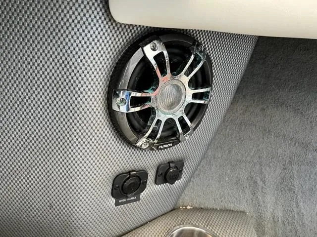 Slide: The Image of 2008 Sea Ray 230 Select Fission boat interior speaker and power outlets. - 13