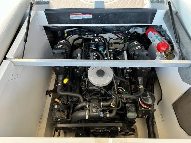 Slide: The Image of 2008 Sea Ray 230 Select Fission boat engine compartment with fire extinguisher. - 15