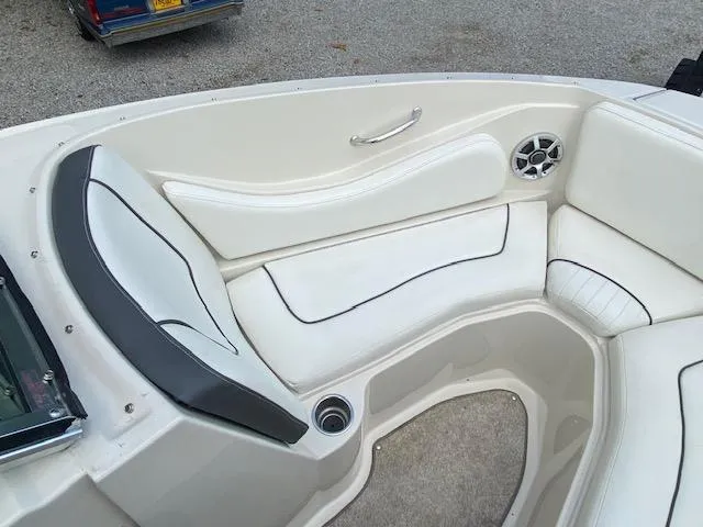 Slide: The Image of 2008 Sea Ray 230 Select Fission boat interior seating with white and black upholstery. - 18