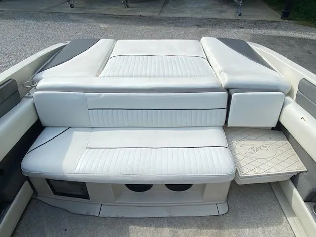 Slide: The Image of 2008 Sea Ray 230 Select Fission boat interior seating area. - 26