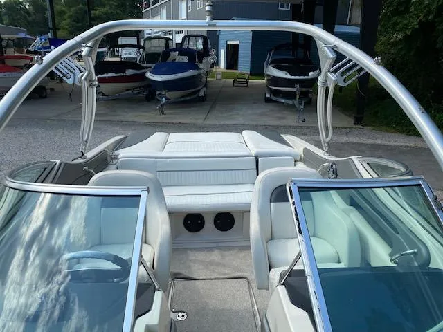 Slide: The Image of 2008 Sea Ray 230 Select Fission boat interior with white seating and wakeboard tower. - 28