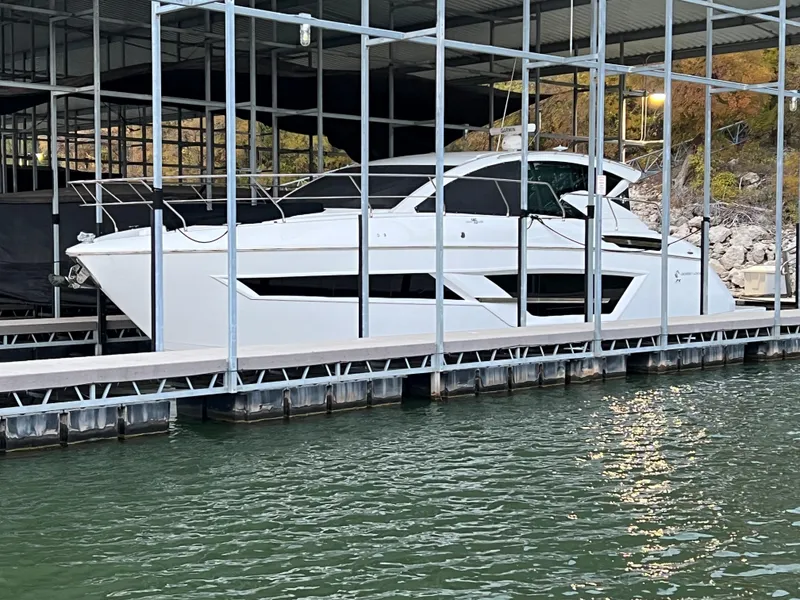 Slide: The Image of 2020 Cruisers Yachts 460 Cantius docked in a marina. - 0