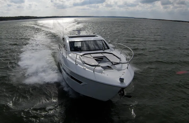 Slide: The Image of 2020 Cruisers Yachts 460 Cantius cruising on open water. - 1