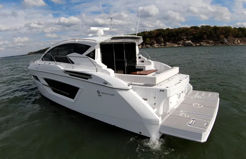 Slide: The Image of 2020 Cruisers Yachts 460 Cantius on open water, rear view. - 15