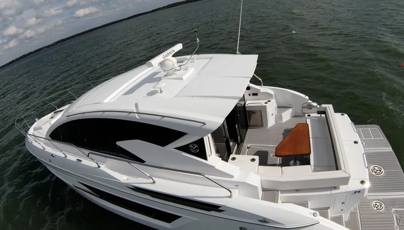 Slide: The Image of 2020 Cruisers Yachts 460 Cantius luxury motor yacht on open water. - 18