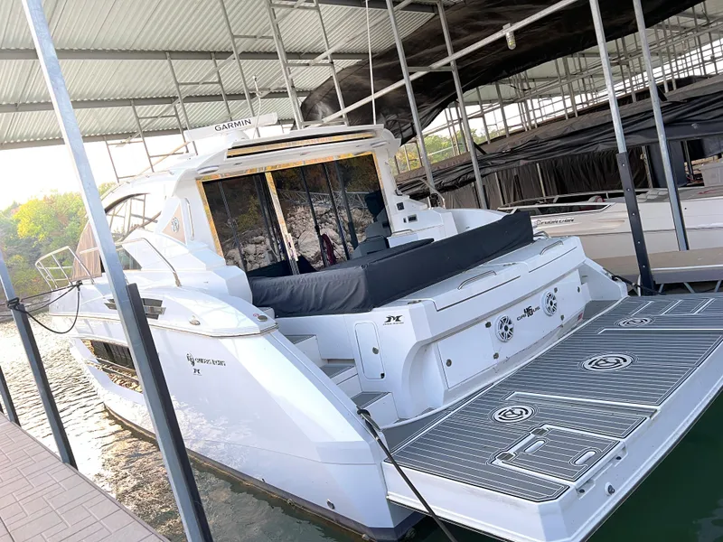 Slide: The Image of 2020 Cruisers Yachts 460 Cantius docked in a covered marina. - 25