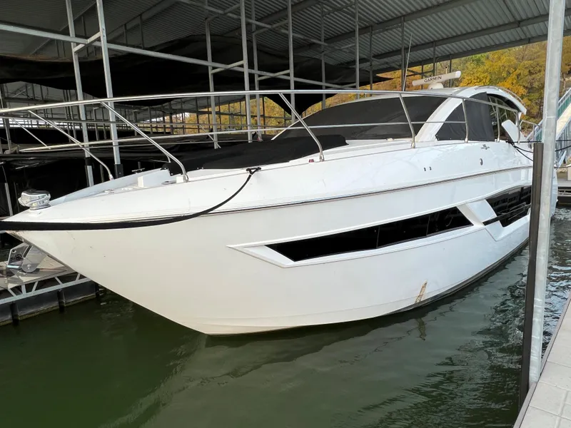 Slide: The Image of 2020 Cruisers Yachts 460 Cantius docked in a marina. - 26