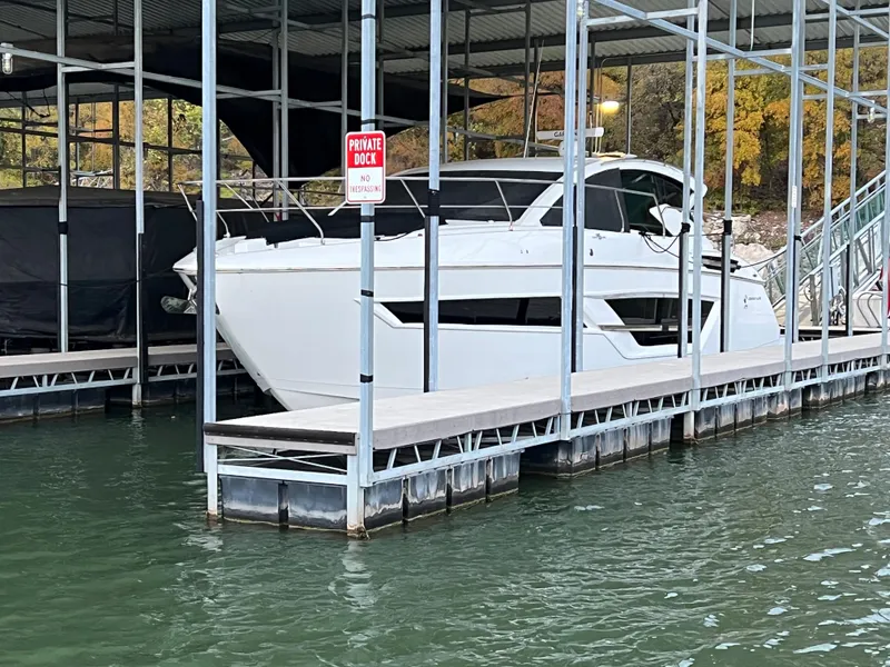 Slide: The Image of 2020 Cruisers Yachts 460 Cantius docked in a private marina. - 28