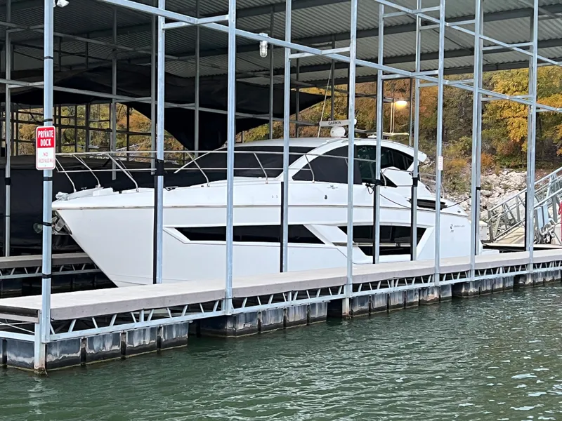 Slide: The Image of 2020 Cruisers Yachts 460 Cantius docked in a covered marina. - 29
