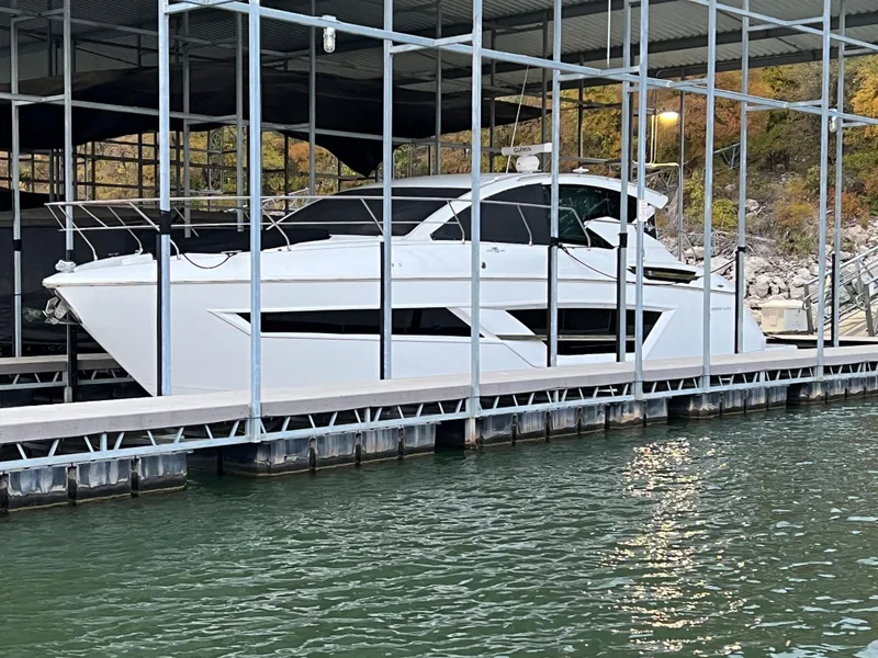 Slide: The Image of 2020 Cruisers Yachts 460 Cantius docked in a marina. - 30