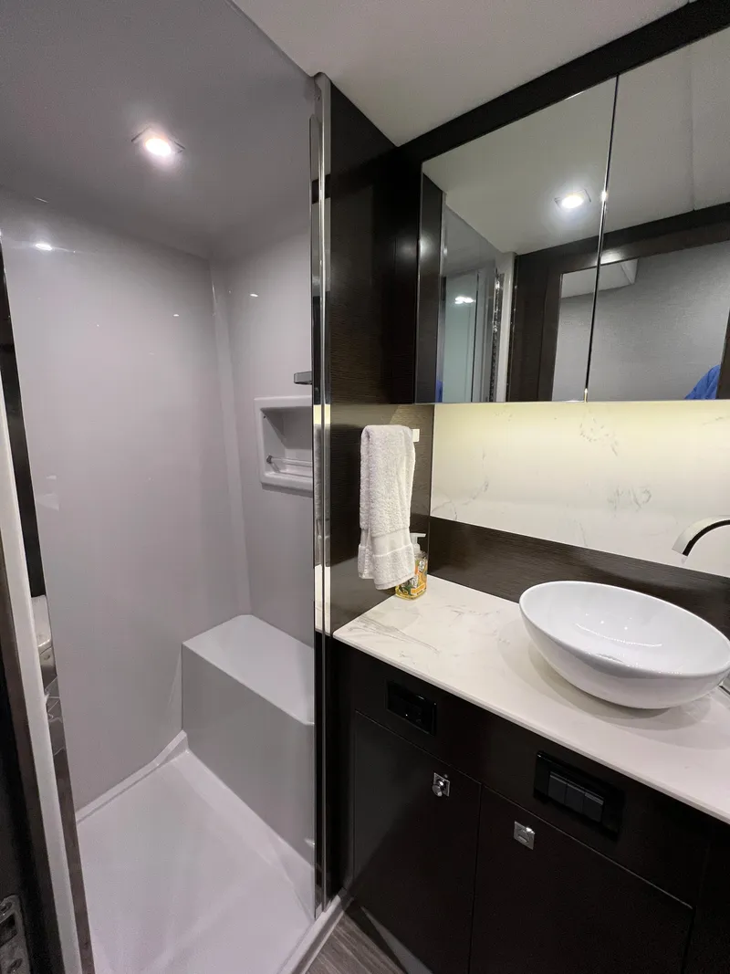 Slide: The Image of Modern bathroom in 2020 Cruisers Yachts 460 Cantius with sleek shower and vessel sink. - 32