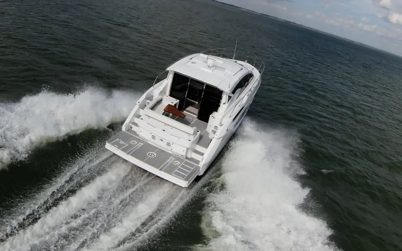 Slide: The Image of 2020 Cruisers Yachts 460 Cantius cruising on open water. - 4