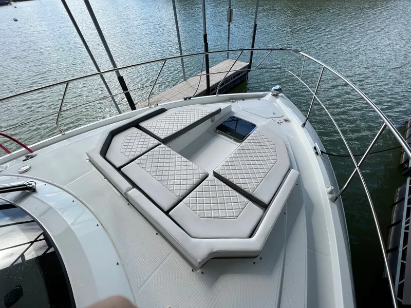 Slide: The Image of 2020 Cruisers Yachts 460 Cantius bow with cushioned seating area. - 45