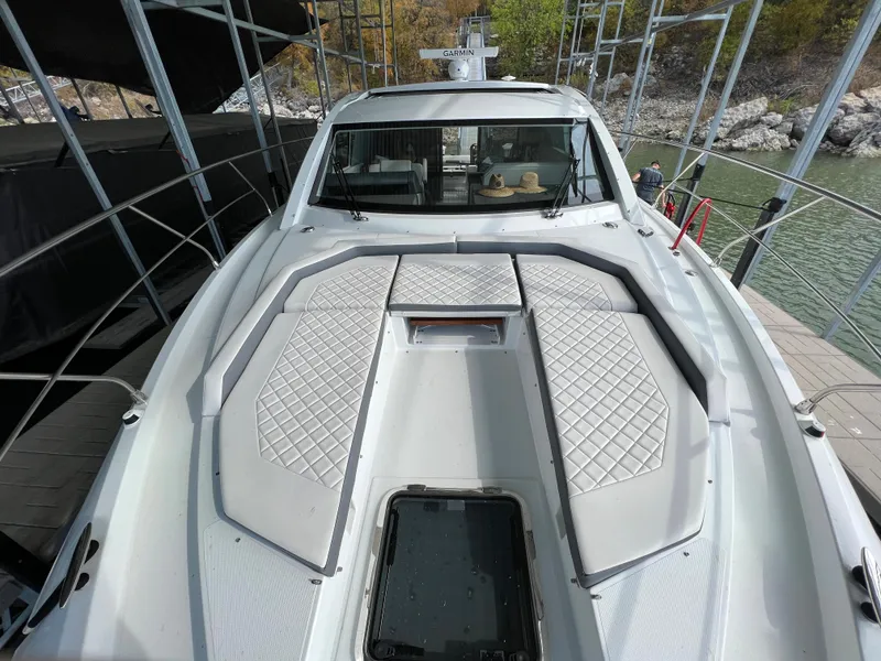 Slide: The Image of 2020 Cruisers Yachts 460 Cantius bow view with cushioned seating and hatch. - 46