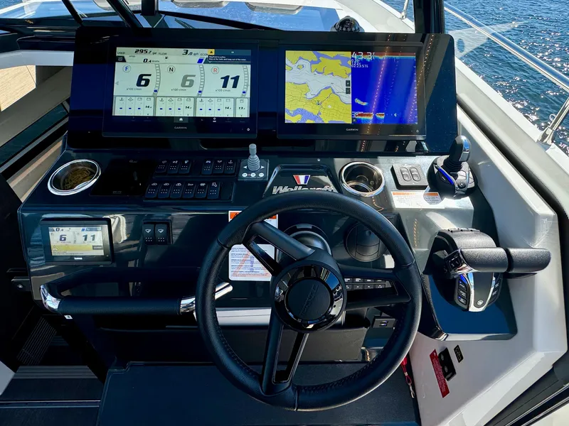Slide: The Image of 2024 Wellcraft 355 helm with advanced navigation displays and controls. - 19