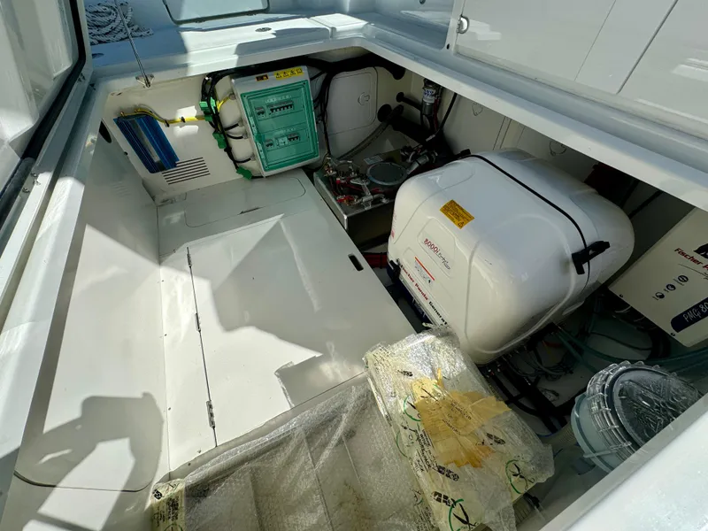 Slide: The Image of 2024 Wellcraft 355 engine compartment with generator and equipment. - 25