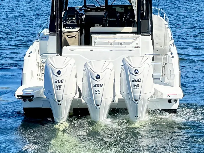 Slide: The Image of 2024 Wellcraft 355 boat with triple 300 V6 engines on water. - 7