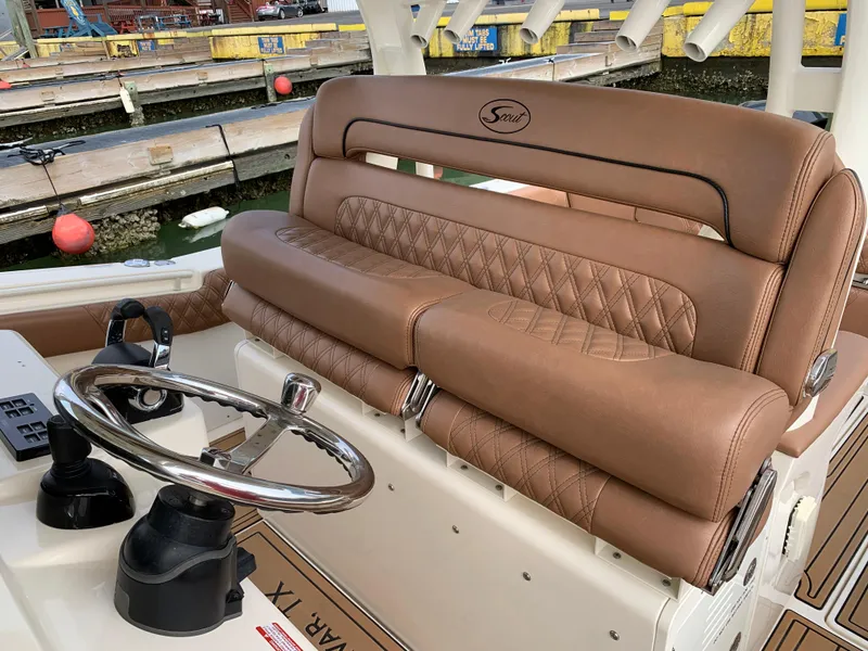 Slide: The Image of Luxurious leather seating on 2018 Scout 350 LXF boat, featuring elegant diamond stitching. - 23