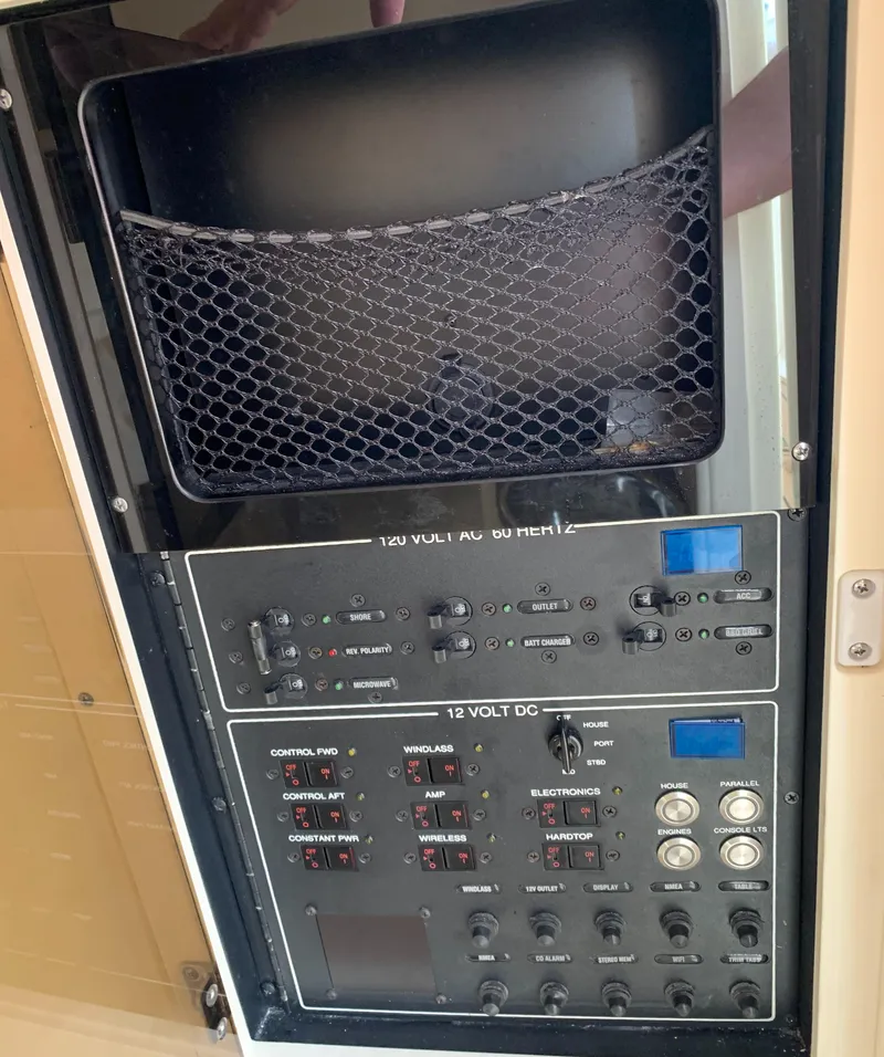 Slide: The Image of Control panel of a 2018 Scout 350 LXF boat, featuring 120V AC and 12V DC systems. - 35