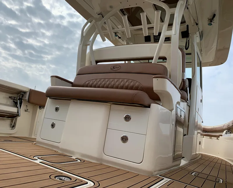 Slide: The Image of 2018 Scout 350 LXF boat interior with luxurious seating and storage. - 45