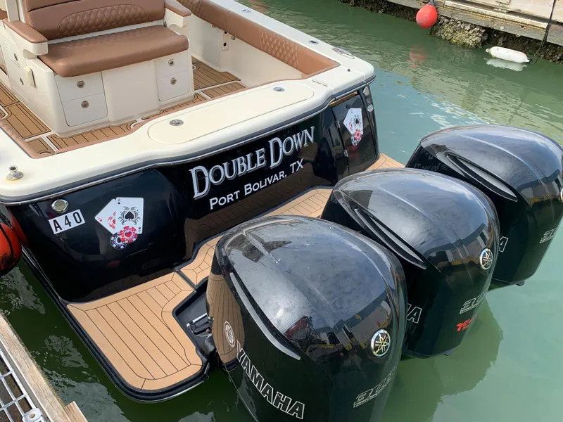 Slide: The Image of 2018 Scout 350 LXF boat with Yamaha engines, docked in Port Bolivar, TX. - 8