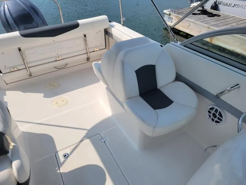 Slide: The Image of 2023 Robalo 227 DC boat interior with white seating and sleek design. - 3
