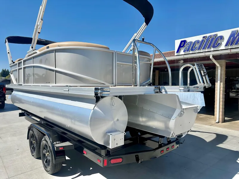 Slide: The Image of 2023 Barletta Cabrio 20Q pontoon boat with 150HP Mercury engine on trailer. - 11