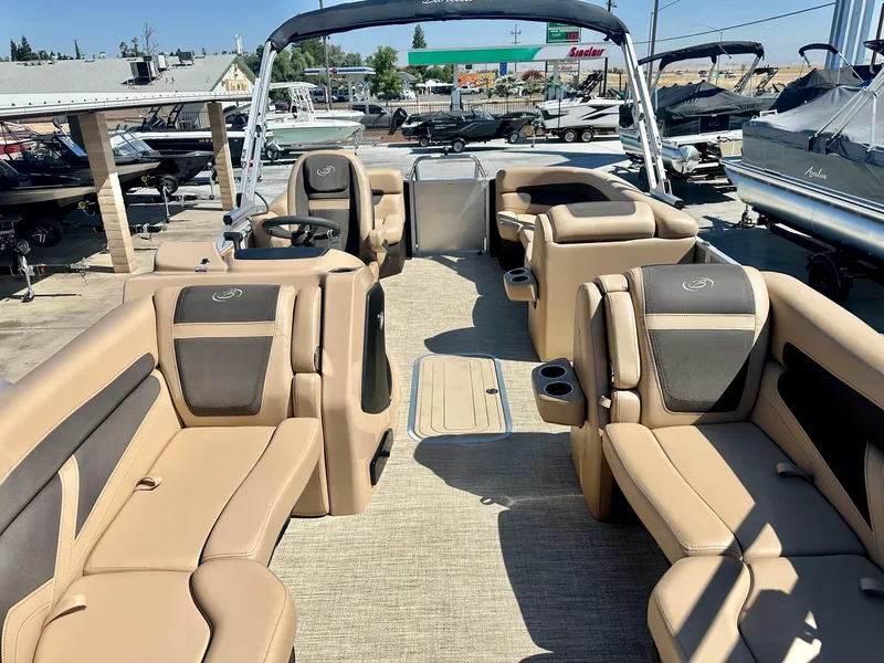 Slide: The Image of 2023 Barletta Cabrio 20Q pontoon boat with 150HP Mercury engine, beige and black interior. - 12