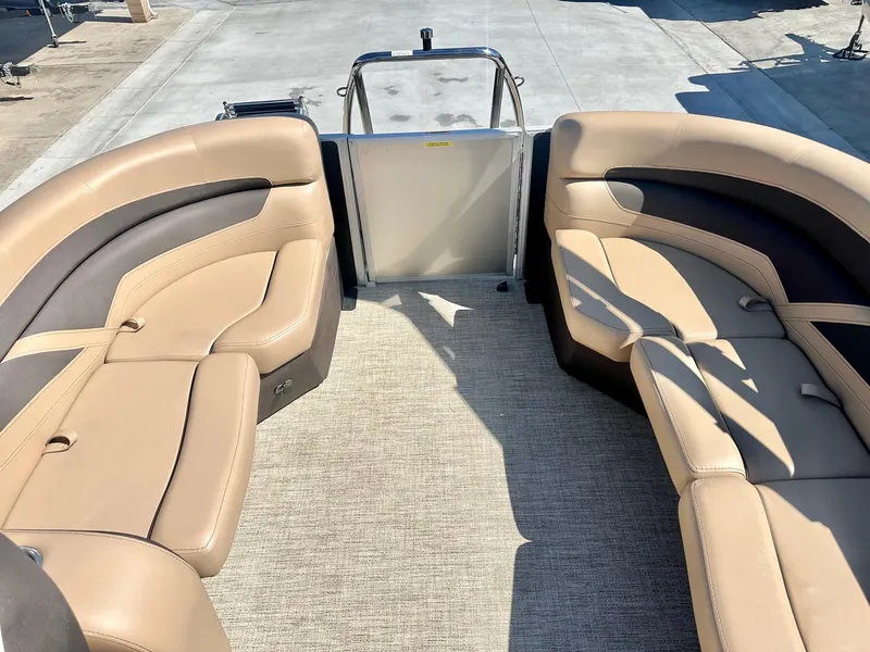 Slide: The Image of 2023 Barletta Cabrio 20Q boat interior with tan leather seating and spacious layout. - 13
