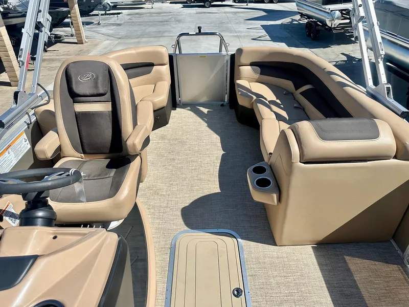 Slide: The Image of 2023 Barletta Cabrio 20Q boat interior with tan and black seating. - 4
