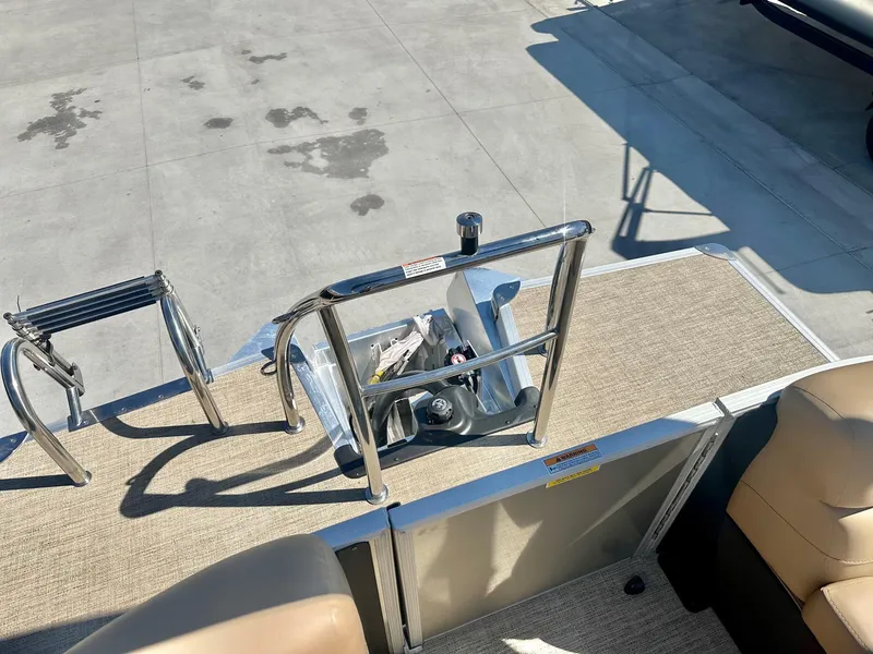 Slide: The Image of 2023 Barletta Cabrio 20Q boat with 150HP Mercury engine, rear deck and ladder. - 5