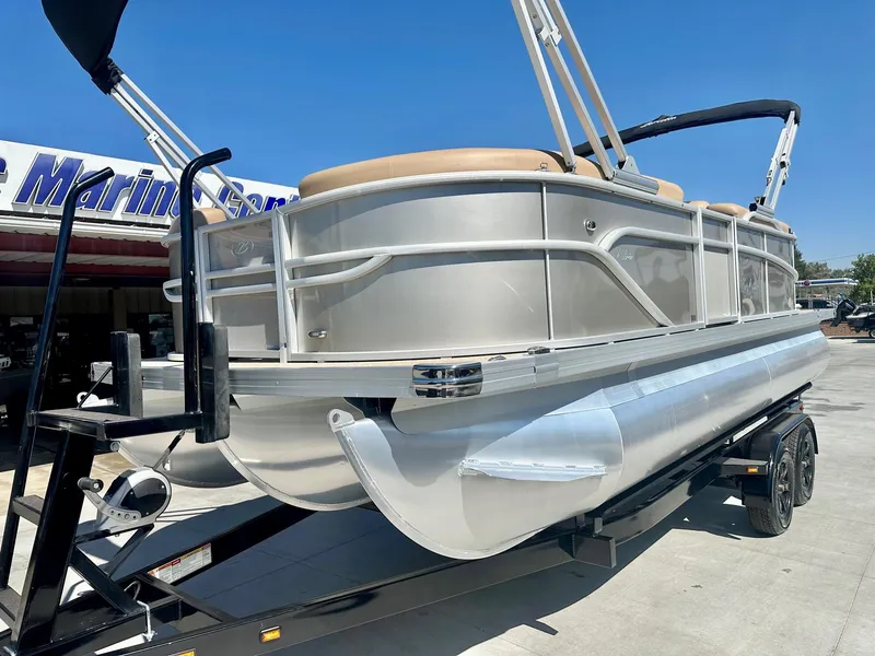 Slide: The Image of 2023 Barletta Cabrio 20Q pontoon boat with 150HP Mercury engine on trailer. - 9