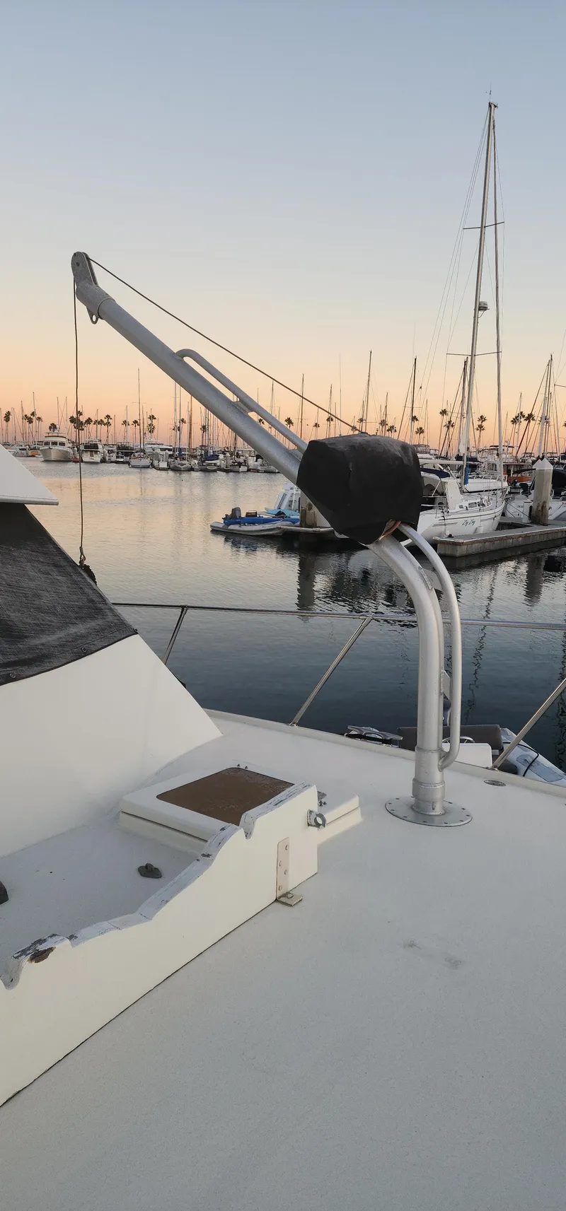 Slide: The Image of 1978 Hatteras Sportfish yacht docked at sunset with marina view. - 13