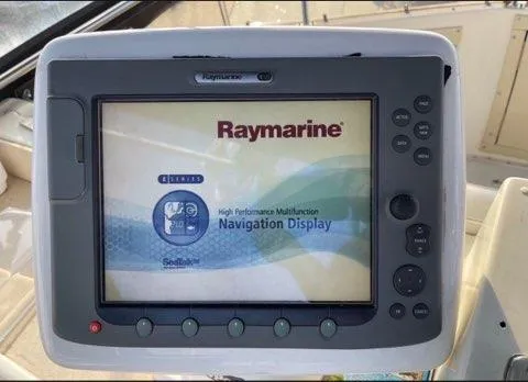 Slide: The Image of Raymarine navigation display on 1978 Hatteras Sportfish boat dashboard. - 17
