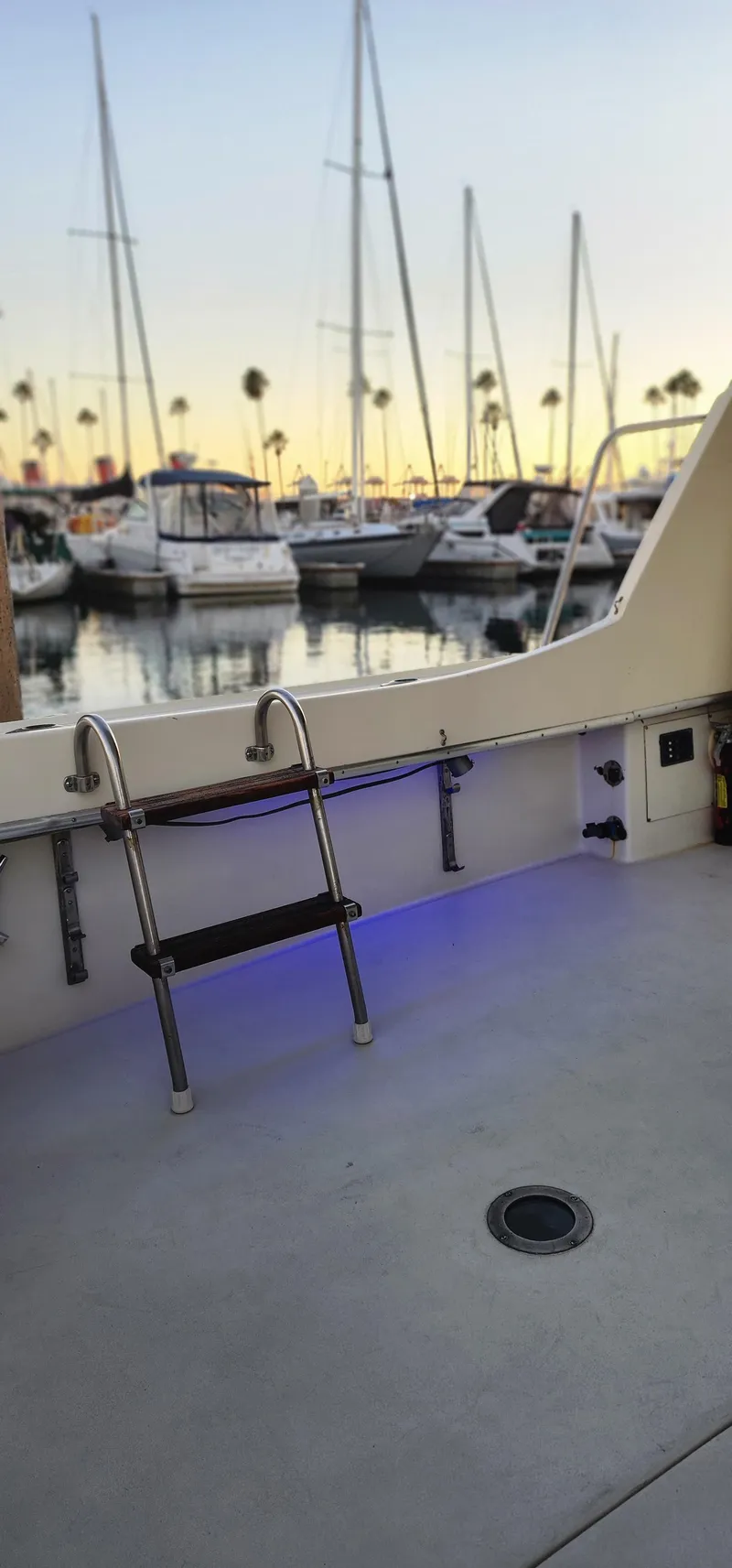 Slide: The Image of 1978 Hatteras Sportfish boat docked at marina with sunset view. - 21