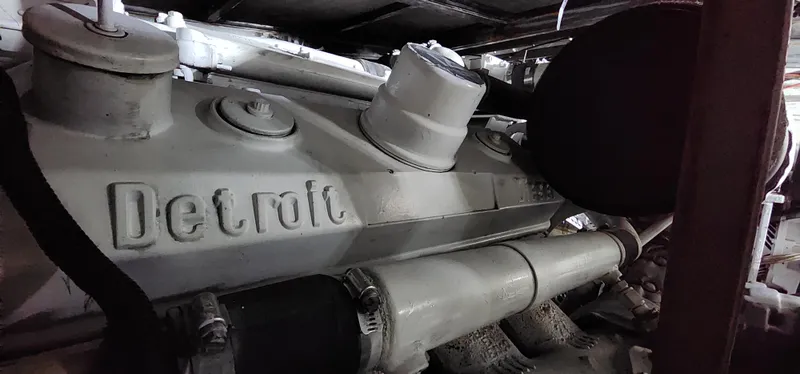 Slide: The Image of Engine of a 1978 Hatteras Sportfish boat, featuring a Detroit Diesel engine. - 28