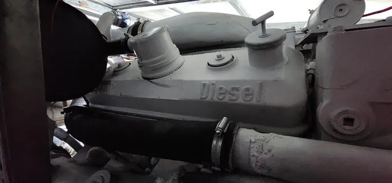 Slide: The Image of 1978 Hatteras Sportfish diesel engine close-up in a boat's engine room. - 29