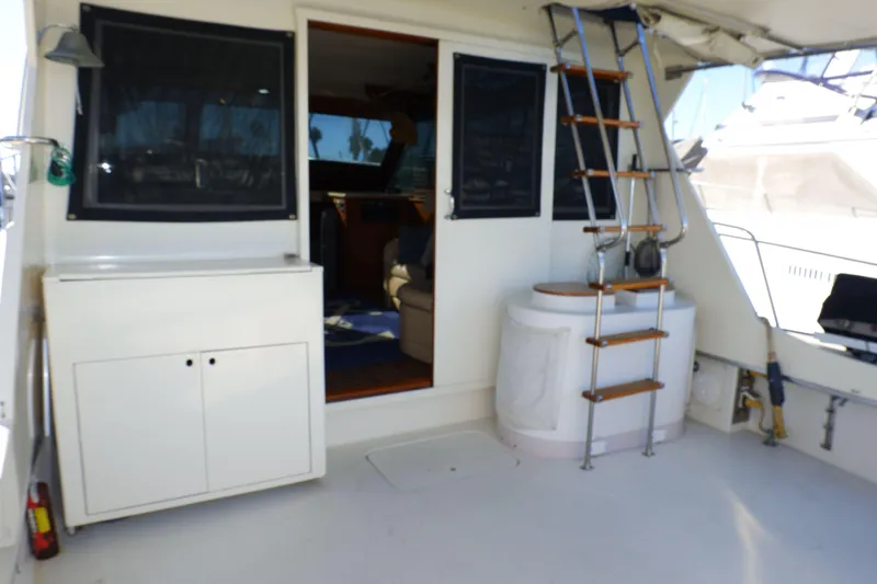 Slide: The Image of 1978 Hatteras Sportfish boat deck with ladder and cabin entrance. - 3