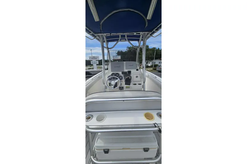 Slide: The Image of 2004 Wellcraft 252 Fisherman boat cockpit with steering wheel and navigation equipment. - 11