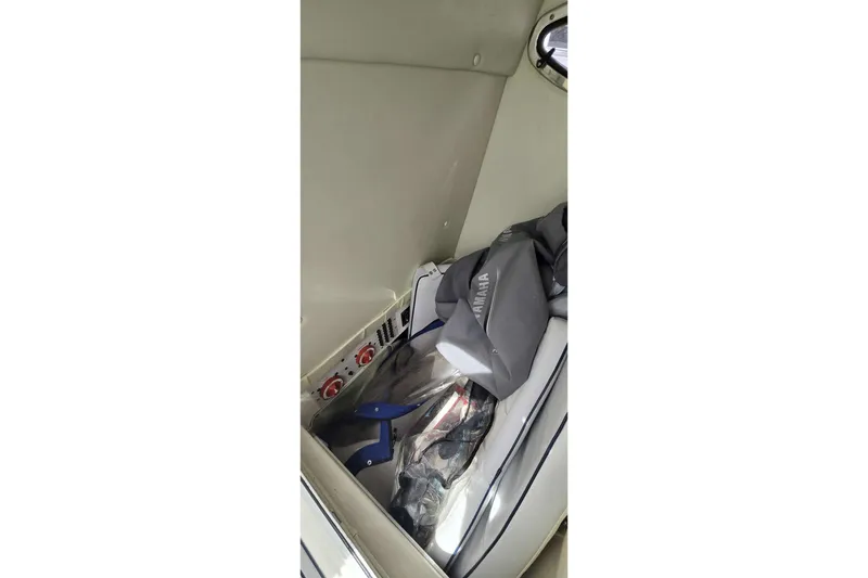 Slide: The Image of Interior of 2004 Wellcraft 252 Fisherman boat with Yamaha equipment and storage area. - 15