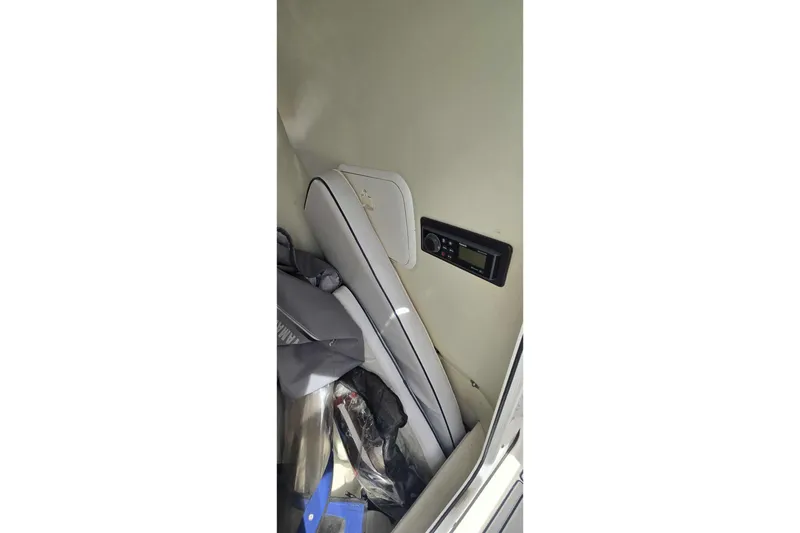 Slide: The Image of Interior of 2004 Wellcraft 252 Fisherman boat showing seating and control panel. - 17