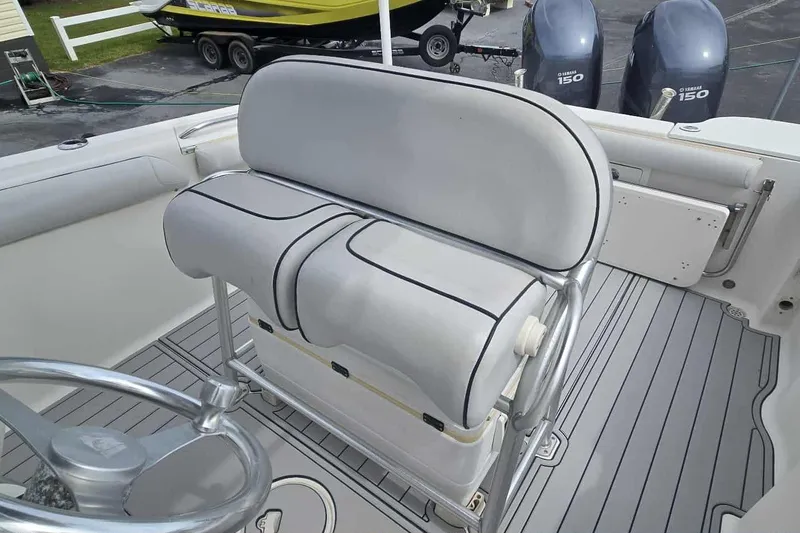 Slide: The Image of 2004 Wellcraft 252 Fisherman boat interior with dual seats and steering wheel. - 8