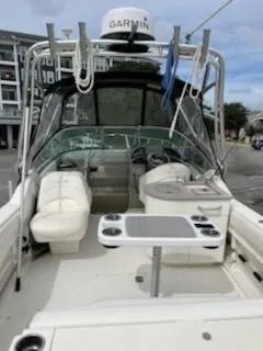 Slide: The Image of 2005 Sea Ray 270 Amberjack boat interior with seating and navigation equipment. - 10