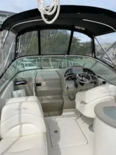 Slide: The Image of 2005 Sea Ray 270 Amberjack boat interior with helm and seating. - 11