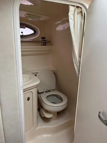 Slide: The Image of Compact bathroom in 2005 Sea Ray 270 Amberjack boat with toilet and sink. - 15
